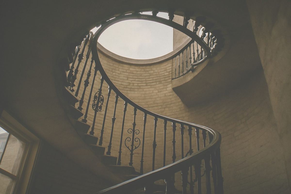 Sunlit staircase and ornate terracotta architecture inside the museum building