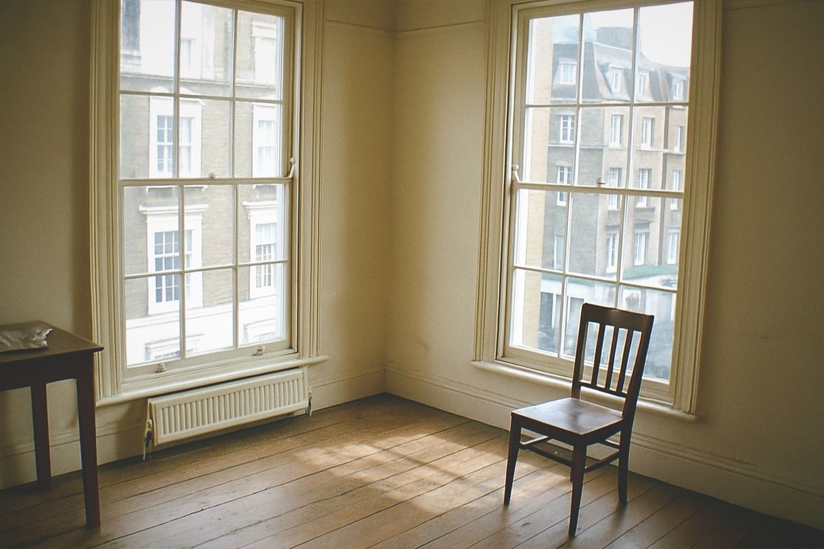 Visitors browsing sculpture galleries inside a bright museum hall